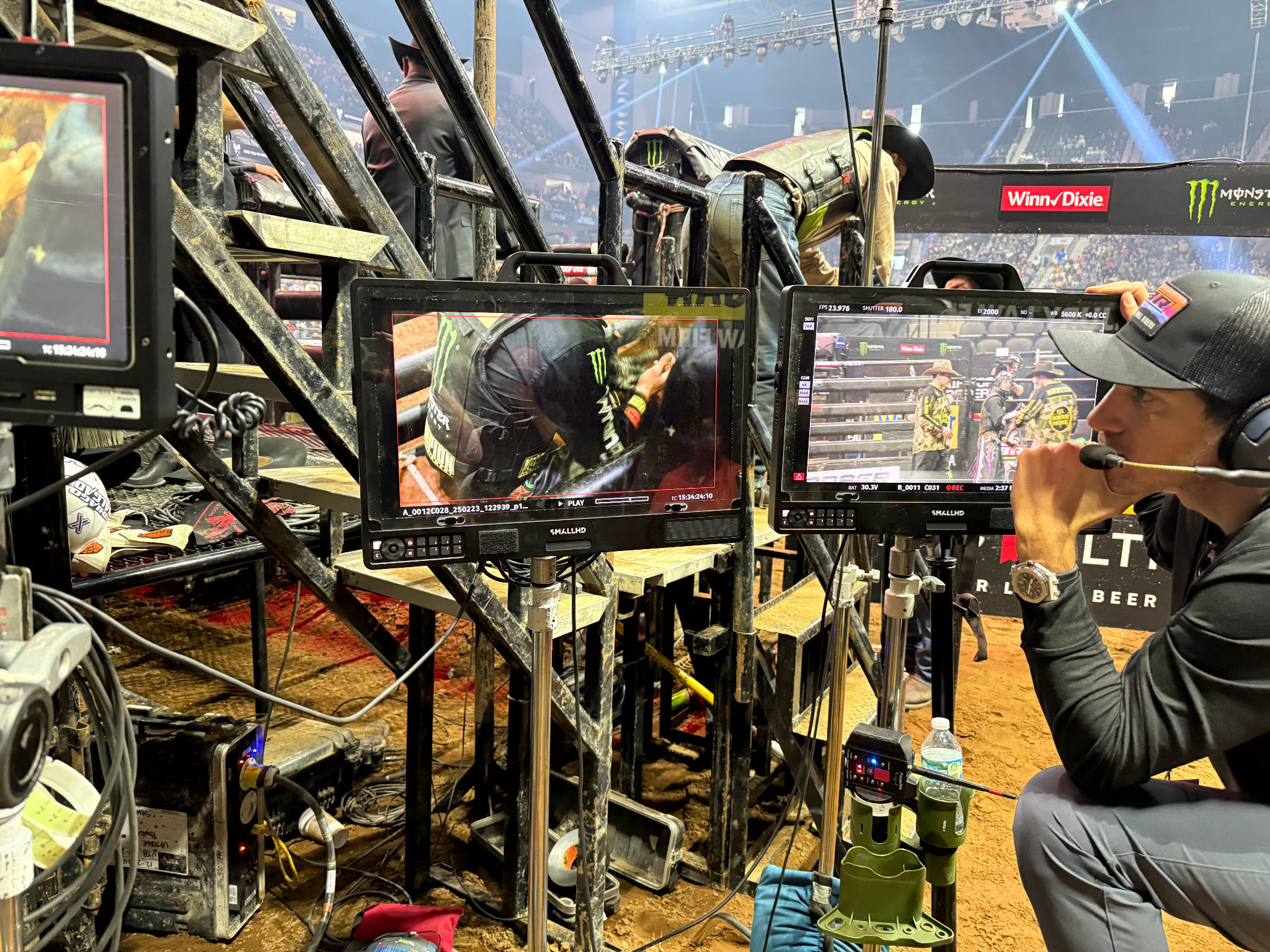 PBR arena — multiple production monitors and camera crew in the dirt