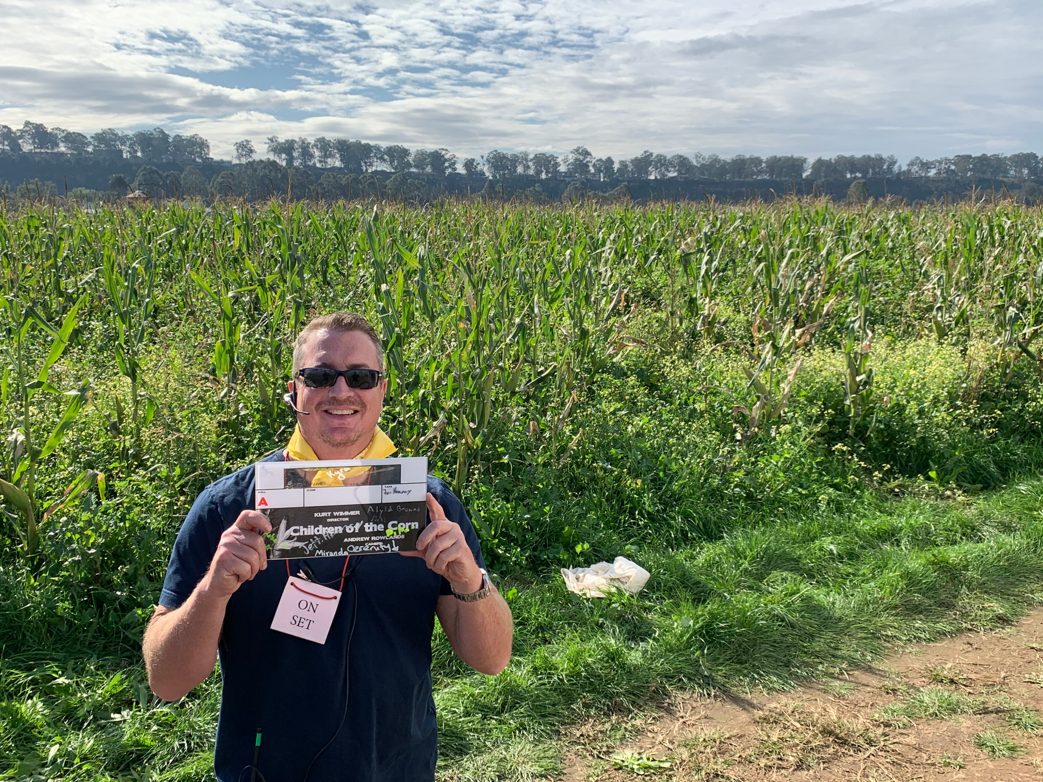 Sean Lee Harner holding Children of the Corn slate on location